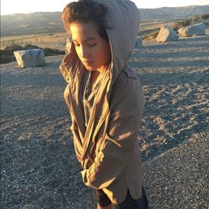 tan jacket wit a hoodie